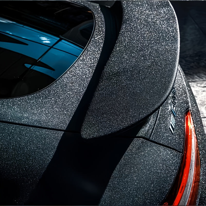 Elevate the look of your vehicle with this versatile universal fit PVC vinyl film. The diamond grain black car wrap adds a touch of style with its full body adhesive sticker, providing a sleek and modern appearance to your car.
