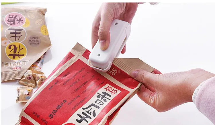 Seal your food bags easily with this mini heat bag seal machine—thermal plastic sealer perfect for keeping packages fresh and airtight!