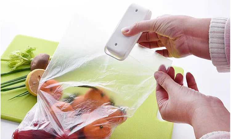 Seal your food bags easily with this mini heat bag seal machine—thermal plastic sealer perfect for keeping packages fresh and airtight!